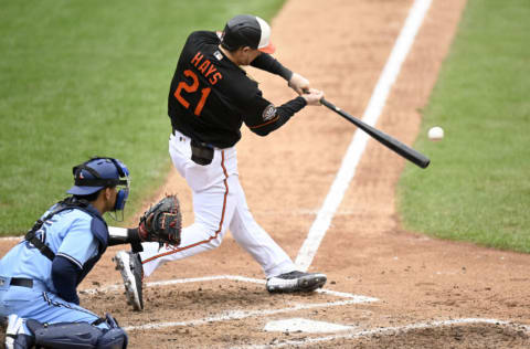 BALTIMORE, MARYLAND - OCTOBER 05: Austin Hays #21 of the Baltimore Orioles drives in two runs with a double in the sixth inning against the Toronto Blue Jays during game one of a doubleheader at Oriole Park at Camden Yards on October 05, 2022 in Baltimore, Maryland. (Photo by Greg Fiume/Getty Images)