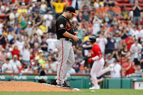 Keegan Akin #45 of the Baltimore Orioles walks off the mound as Bobby Dalbec #29 of the Boston Red Sox rounds the bases after his home run during the sixth inning. (Photo By Winslow Townson/Getty Images)