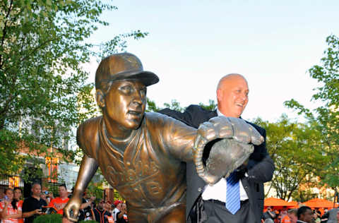 September 6, 2012; Baltimore, MD, USA; Cal Ripken poses with his statue after the Orioles Legends ceremony in his honor prior to a game against the New York Yankees at Oriole Park at Camden Yards. Mandatory Credit: Joy R. Absalon-USA TODAY Sports