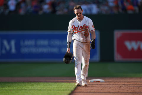 Aug 18, 2022; Baltimore, Maryland, USA; Baltimore Orioles left fielder Austin Hays (21) walks back to the dugout after being called out in a double play during the ninth inning to end the game against the Chicago Cubs at Oriole Park at Camden Yards. Mandatory Credit: Jessica Rapfogel-USA TODAY Sports