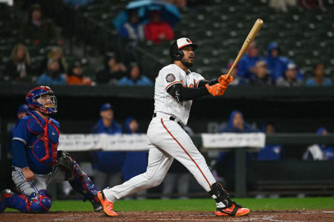 Oct 3, 2022; Baltimore, Maryland, USA; Baltimore Orioles right fielder Anthony Santander (25) hits sacrifice fly to right field scoring shortstop Jorge Mateo (3) in the third inning against the Toronto Blue Jays at Oriole Park at Camden Yards. Mandatory Credit: Tommy Gilligan-USA TODAY Sports