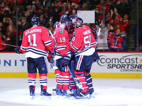 Jan 12, 2016; Chicago, IL, USA; Chicago Blackhawks goalie Corey Crawford (50) is congratulated by center Jonathan Toews (19) following the third period against the Nashville Predators at the United Center. Chicago won 3-2. Mandatory Credit: Dennis Wierzbicki-USA TODAY Sports