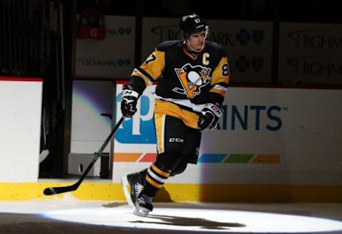 Jan 2, 2016; Pittsburgh, PA, USA; Pittsburgh Penguins center Sidney Crosby (87) reacts after being named the first star of the game against the New York Islanders at the CONSOL Energy Center. The Penguins won 5-2. Mandatory Credit: Charles LeClaire-USA TODAY Sports