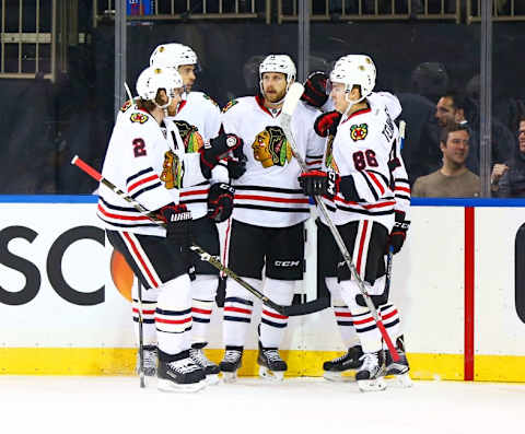 Feb 17, 2016; New York, NY, USA; Chicago Blackhawks left wing Andrew Desjardins (11) is congratulated after scoring a first period goal against the New York Rangers at Madison Square Garden. Mandatory Credit: Andy Marlin-USA TODAY Sports