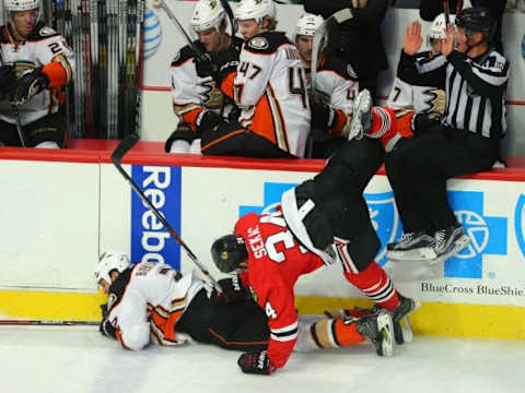 Feb 13, 2016; Chicago, IL, USA; Chicago Blackhawks left wing Jiri Sekac (34) and Anaheim Ducks defenseman Kevin Bieksa (2) collide during the third period at the United Center. Anaheim won 3-2 in overtime. Mandatory Credit: Dennis Wierzbicki-USA TODAY Sports