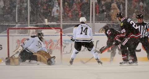 Mar 1, 2014; Chicago, IL, USA; Chicago Blackhawks right wing Kris Versteeg (23) scores a goal past Pittsburgh Penguins goalie Marc-Andre Fleury (29) during the second period in a Stadium Series hockey game at Soldier Field. Mandatory Credit: Rob Grabowski-USA TODAY Sports