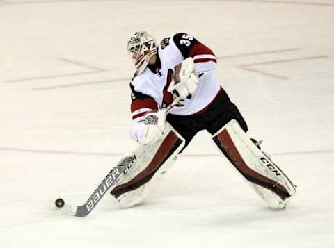 Jan 26, 2016; Winnipeg, Manitoba, CAN; Arizona Coyotes goalie Louis Domingue (35) looks to clear the puck during the second period against the Winnipeg Jets at MTS Centre. Mandatory Credit: Bruce Fedyck-USA TODAY Sports