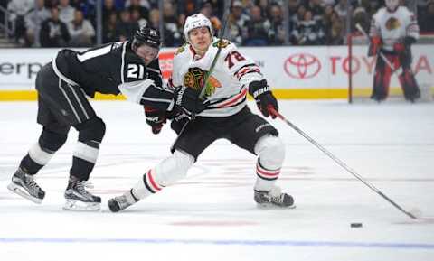 Nov 28, 2015; Los Angeles, CA, USA; Chicago Blackhawks left wing Artemi Panarin (72) and Los Angeles Kings center Nick Shore (21) battle for the puck in the third period of the game at Staples Center. Kings won 3-2. Mandatory Credit: Jayne Kamin-Oncea-USA TODAY Sports