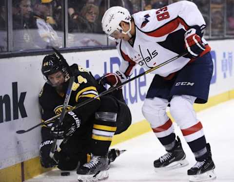 Mar 5, 2016; Boston, MA, USA; Washington Capitals center Jay Beagle (83) battles with Boston Bruins defenseman Dennis Seidenberg (44) during the third period at TD Garden. Mandatory Credit: Bob DeChiara-USA TODAY Sports