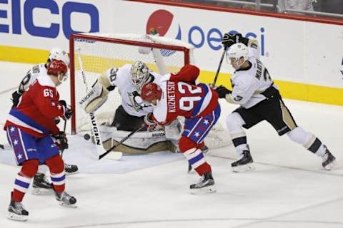 Mar 1, 2016; Washington, DC, USA; Washington Capitals center Evgeny Kuznetsov (92) scores a goal on Pittsburgh Penguins goalie Matt Murray (30) in the second period at Verizon Center. Mandatory Credit: Geoff Burke-USA TODAY Sports