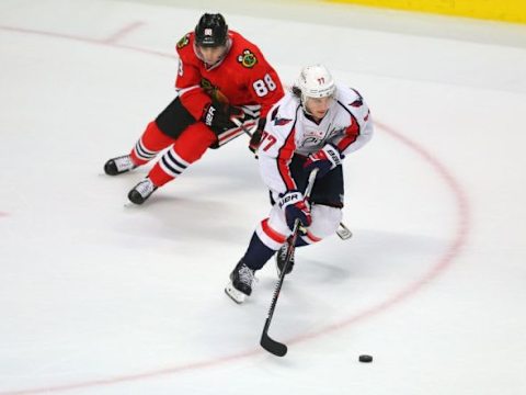 Feb 28, 2016; Chicago, IL, USA; Washington Capitals right wing T.J. Oshie (77) is pursued by Chicago Blackhawks right wing Patrick Kane (88) during the third period at the United Center. Chicago won 3-2. Mandatory Credit: Dennis Wierzbicki-USA TODAY Sports