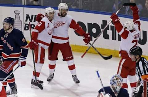 Apr 9, 2016; New York, NY, USA; Detroit Red Wings center Riley Sheahan (15) celebrates scoring a goal with teammates past New York Rangers goalie Antti Raanta (32) during the second period at Madison Square Garden. Mandatory Credit: Adam Hunger-USA TODAY Sports