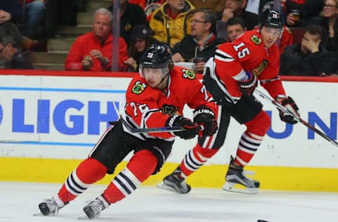 Feb 25, 2016; Chicago, IL, USA; Chicago Blackhawks left wing Artemi Panarin (72) passes the puck with center Artem Anisimov (15) pursuing during the second period against the Nashville Predators at the United Center. Mandatory Credit: Dennis Wierzbicki-USA TODAY Sports