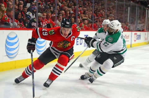 Mar 22, 2016; Chicago, IL, USA; Chicago Blackhawks center Jonathan Toews (19) is pursued by Dallas Stars defenseman Johnny Oduya (47) during the second period at the United Center. Mandatory Credit: Dennis Wierzbicki-USA TODAY Sports