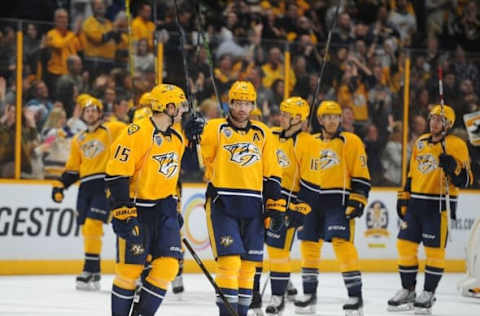 Apr 7, 2016; Nashville, TN, USA; Nashville Predators players celebrate after a 3-2 overtime win against the Arizona Coyotes at Bridgestone Arena. Mandatory Credit: Christopher Hanewinckel-USA TODAY Sports