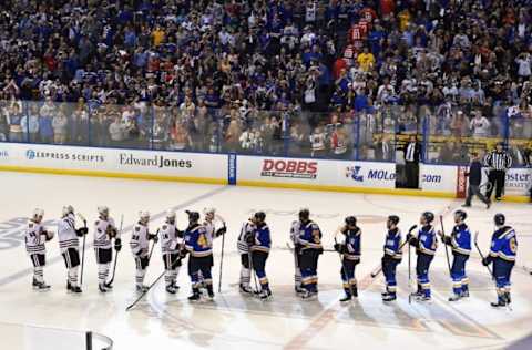 Apr 25, 2016; St. Louis, MO, USA; St. Louis Blues and Chicago Blackhawks teammates line up to shake hands after St. Louis Blues defeat the Chicago Blackhawks 3-2 in game seven of the first round of the 2016 Stanley Cup Playoffs at Scottrade Center. Mandatory Credit: Jasen Vinlove-USA TODAY Sports