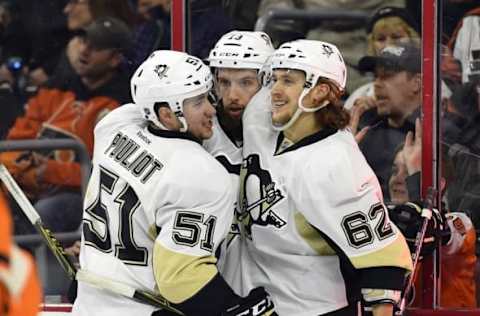 Apr 9, 2016; Philadelphia, PA, USA; Pittsburgh Penguins center Nick Bonino (13) celebrates with defenseman Derrick Pouliot (51) and left wing Carl Hagelin (62) after scoring a goal past Philadelphia Flyers goalie Steve Mason (not pictured) during the first period at Wells Fargo Center. Mandatory Credit: Derik Hamilton-USA TODAY Sports