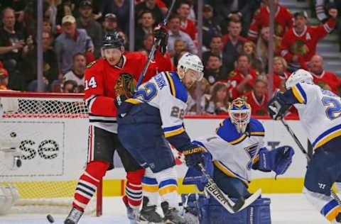 Apr 23, 2016; Chicago, IL, USA; Chicago Blackhawks right wing Richard Panik (14) and St. Louis Blues defenseman Kevin Shattenkirk (22) and goaltender Brian Elliott (1) watch the puck during the first period in game six of the first round of the 2016 Stanley Cup Playoffs at the United Center. Mandatory Credit: Dennis Wierzbicki-USA TODAY Sports