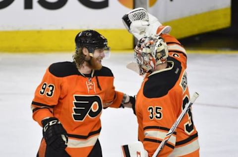 Apr 9, 2016; Philadelphia, PA, USA; Philadelphia Flyers left wing Jakub Voracek (93) celebrates with goalie Steve Mason (35) after a victory against the Pittsburgh Penguins at Wells Fargo Center. The Flyers won 3-1. Mandatory Credit: Derik Hamilton-USA TODAY Sports