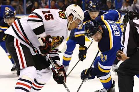 Apr 21, 2016; St. Louis, MO, USA; Chicago Blackhawks center Artem Anisimov (15) and St. Louis Blues center Patrik Berglund (21) face-off during game five of the first round of the 2016 Stanley Cup Playoffs at Scottrade Center. The Blackhawks won the game 4-3 in double overtime. Mandatory Credit: Billy Hurst-USA TODAY Sports