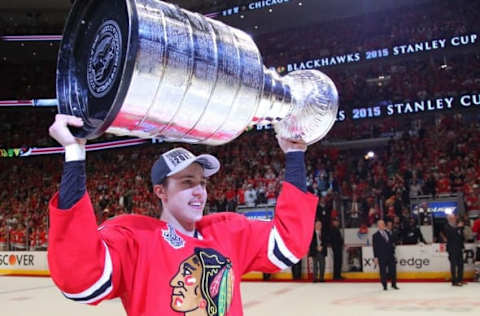 Jun 15, 2015; Chicago, IL, USA; Chicago Blackhawks left wing Teuvo Teravainen (86) hoists the Stanley Cup after defeating the Tampa Bay Lightning in game six of the 2015 Stanley Cup Final at United Center. Mandatory Credit: Dennis Wierzbicki-USA TODAY Sports