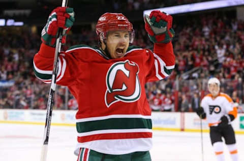 Feb 16, 2016; Newark, NJ, USA; New Jersey Devils right wing Jordin Tootoo (22) celebrates his goal during the third period against the Philadelphia Flyers at Prudential Center. The Flyers defeated the Devils 6-3. Mandatory Credit: Ed Mulholland-USA TODAY Sports