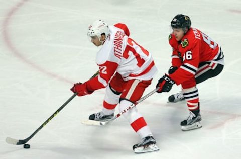 Mar 6, 2016; Chicago, IL, USA; Detroit Red Wings center Andreas Athanasiou (72) is pressured by Chicago Blackhawks left wing Teuvo Teravainen (86) during the third period at the United Center. Chicago won 4-1. Credit: Dennis Wierzbicki-USA TODAY Sports