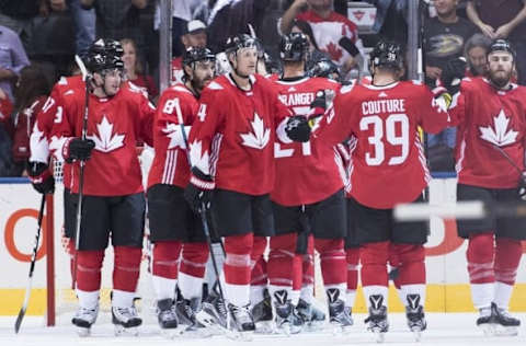 Sep 17, 2016; Toronto, Ontario, Canada; Team Canada players Jay Bouwmeester (4) and Logan Couture (39) celebrate the win at the end of the preliminary round play against Team Czech Republic in the 2016 World Cup of Hockey at Air Canada Centre. Team Canada won 6-0. Mandatory Credit: Nick Turchiaro-USA TODAY Sports