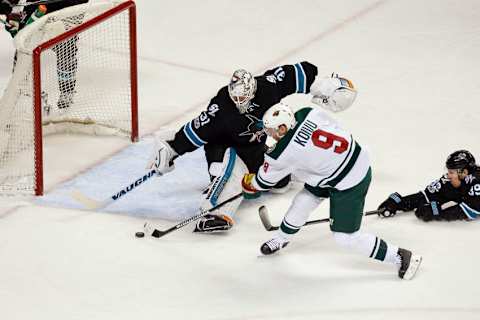 Jan 5, 2017; San Jose, CA, USA; Minnesota Wild center Mikko Koivu (9) shoots the puck against San Jose Sharks goalie Martin Jones (31) during the third period of the game at SAP Center at San Jose. The Minnesota Wild defeated the San Jose Sharks with a score of 5-4. Mandatory Credit: Stan Szeto-USA TODAY Sports