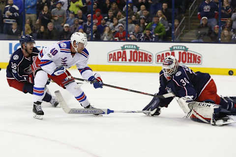 Jan 7, 2017; Columbus, OH, USA; New York Rangers right wing Michael Grabner (40) lifts the puck over Columbus Blue Jackets goalie Curtis McElhinney (30) for the game winning goal during the third period at Nationwide Arena. The Rangers defeated the Blue Jackets 5-4. Mandatory Credit: Russell LaBounty-USA TODAY Sports