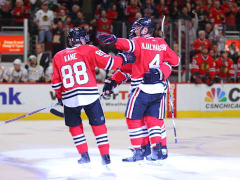 Jan 8, 2017; Chicago, IL, USA; Chicago Blackhawks defenseman Niklas Hjalmarsson (4) is congratulated for scoring by right wing Patrick Kane (88) during the first period against the Nashville Predators at the United Center. Mandatory Credit: Dennis Wierzbicki-USA TODAY Sports