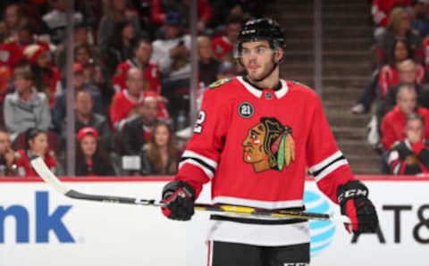 CHICAGO, IL – OCTOBER 28: Alex DeBrincat #12 of the Chicago Blackhawks looks across the ice in the third period against the Edmonton Oilers at the United Center on October 28, 2018 in Chicago, Illinois. The Edmonton Oilers defeated the Chicago Blackhawks 2-1. (Photo by Chase Agnello-Dean/NHLI via Getty Images)