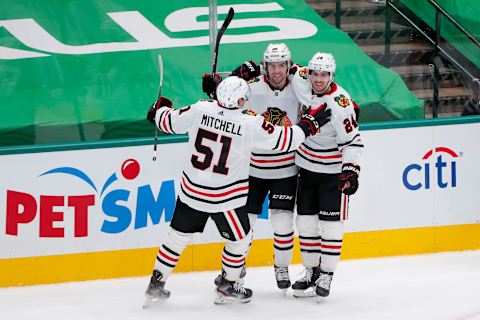 Ian Mitchell #51, Brandon Hagel #38, Pius Suter #24, Chicago Blackhawks (Photo by Tom Pennington/Getty Images)