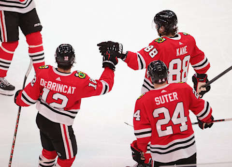 Chicago Blackhawks, Alex DeBrincat #12, Patrick Kane #88, Pius Suter #24 (Photo by Jonathan Daniel/Getty Images)