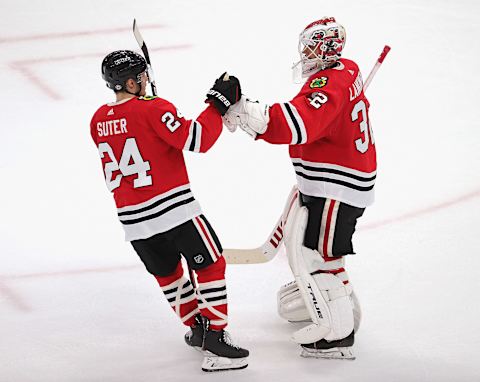 Pius Suter #24, Chicago Blackhawks, Kevin Lankinen #32 (Photo by Jonathan Daniel/Getty Images)