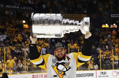 NASHVILLE, TN – JUNE 11: Chris Kunitz #14 of the Pittsburgh Penguins celebrates with the Stanley Cup trophy after defeating the Nashville Predators 2-0 in Game Six of the 2017 NHL Stanley Cup Final at the Bridgestone Arena on June 11, 2017 in Nashville, Tennessee. (Photo by Bruce Bennett/Getty Images)