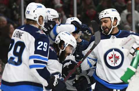 ST. PAUL, MN – JANUARY 13: Winnipeg Jets Left Wing Mathieu Perreault (85) is congratulated by teammates after scoring a goal in the 3rd period during a NHL game between the Minnesota Wild and Winnipeg Jets on January 13, 2018 at Xcel Energy Center in St. Paul, MN. The Wild defeated the Jets 4-1.(Photo by Nick Wosika/Icon Sportswire via Getty Images)