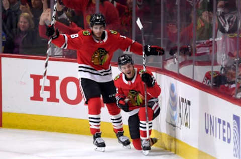 CHICAGO, IL – MARCH 18: Chicago Blackhawks right wing Alex DeBrincat (12) celebrates with Chicago Blackhawks center Nick Schmaltz (8) and teammates after scoring a goal in the first period of play during a game between the Chicago Blackhawks and the St. Louis Blues on March 18, 2018, at the United Center in Chicago, Illinois. (Photo by Robin Alam/Icon Sportswire via Getty Images)