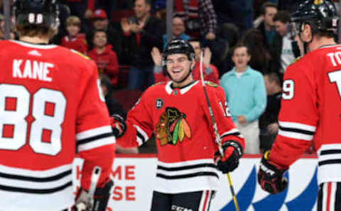 CHICAGO, IL – JANUARY 09: Alex DeBrincat #12 of the Chicago Blackhawks reacts after scoring against the Nashville Predators in the first period at the United Center on January 9, 2019 in Chicago, Illinois. (Photo by Bill Smith/NHLI via Getty Images)