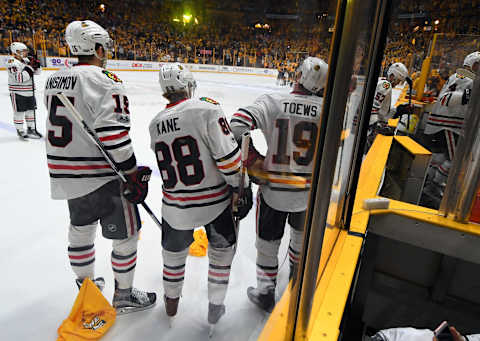 Apr 17, 2017; Nashville, TN, USA; Chicago Blackhawks center Artem Anisimov (15) right winger Patrick Kane (88) and center Jonathan Toews (19) watch as Nashville Predators players celebrate after an overtime win in game three of the first round of the 2017 Stanley Cup Playoffs at Bridgestone Arena. The Predators won in overtime 3-2. Mandatory Credit: Christopher Hanewinckel-USA TODAY Sports