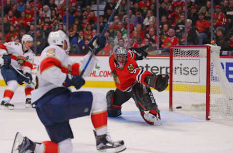 Nov 29, 2016; Chicago, IL, USA; Chicago Blackhawks goalie Corey Crawford (50) makes a pad save on a shot from Florida Panthers center Aleksander Barkov (16) during the first period at the United Center. Mandatory Credit: Dennis Wierzbicki-USA TODAY Sports