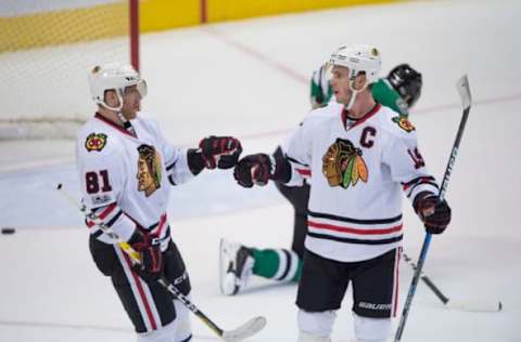 Feb 4, 2017; Dallas, TX, USA; Chicago Blackhawks right wing Marian Hossa (81) and center Jonathan Toews (19) celebrate a goal against the Dallas Stars during the third period at the American Airlines Center. The Blackhawks defeat the Stars 5-3. Mandatory Credit: Jerome Miron-USA TODAY Sports