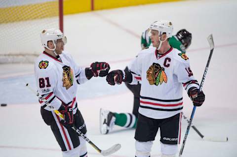 Feb 4, 2017; Dallas, TX, USA; Chicago Blackhawks right wing Marian Hossa (81) and center Jonathan Toews (19) celebrate a goal against the Dallas Stars during the third period at the American Airlines Center. The Blackhawks defeat the Stars 5-3. Mandatory Credit: Jerome Miron-USA TODAY Sports