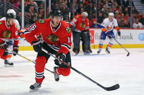 Mar 3, 2017; Chicago, IL, USA; Chicago Blackhawks center Marcus Kruger (16) skates with the puck during the second period against the New York Islanders at the United Center. Chicago won 2-1 in s shoot out. Mandatory Credit: Dennis Wierzbicki-USA TODAY Sports