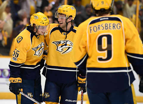 Apr 17, 2017; Nashville, TN, USA; Nashville Predators left wing Kevin Fiala (56) celebrates with center Calle Jarnkrok (19) after scoring the game-winning goal in overtime of game three of the first round of the 2017 Stanley Cup Playoffs at Bridgestone Arena. The Predators won in overtime 3-2. Mandatory Credit: Christopher Hanewinckel-USA TODAY Sports