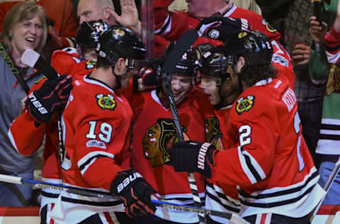 Mar 31, 2017; Chicago, IL, USA; Chicago Blackhawks left wing Artemi Panarin (second from left) celebrates after he scored a goal with Chicago Blackhawks left wing Richard Panik (14), Chicago Blackhawks right wing Patrick Kane (88) and Chicago Blackhawks defenseman Duncan Keith (2) during the first period of their game against the Columbus Blue Jackets at the United Center. Mandatory Credit: Matt Marton-USA TODAY Sports