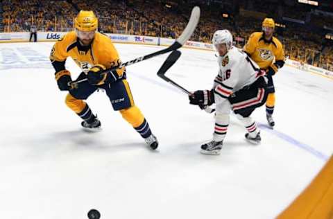 Apr 20, 2017; Nashville, TN, USA; Nashville Predators left wing Harry Zolnierczyk (26) works against Chicago Blackhawks center Marcus Kruger (16) during the first period in game four of the first round of the 2017 Stanley Cup Playoffs at Bridgestone Arena. Mandatory Credit: Christopher Hanewinckel-USA TODAY Sports