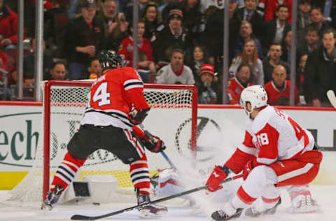 Jan 10, 2017; Chicago, IL, USA; Chicago Blackhawks left wing Richard Panik (14) scores a goal past Detroit Red Wings goalie Petr Mrazek (34) during the first period at the United Center. Mandatory Credit: Dennis Wierzbicki-USA TODAY Sports