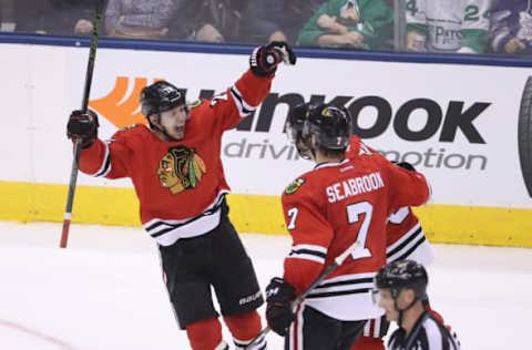 Mar 18, 2017; Toronto, Ontario, CAN; Chicago Blackhawks left wing Ryan Hartman (38) is congratulated by left wing Artemi Panarin (72) and defenseman Brent Seabrook (7) after scoring the game-winning goal in overtime against the Toronto Maple Leafs at Air Canada Centre. The Blackhawks beat the Maple Leafs 2-1 in overtime. Mandatory Credit: Tom Szczerbowski-USA TODAY Sports