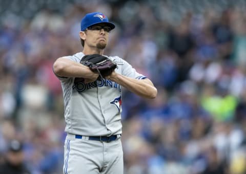 SEATTLE, WA – AUGUST 2: Starter Tyler Clippard #36 of the Toronto Blue Jays reactsa after giving up a two-run home run to Nelson Cruz #23 of the Seattle Mariners that also scored Dee Gordon #9 of the Seattle Mariners during the first inning of a game at Safeco Field on August 2, 2018 in Seattle, Washington. (Photo by Stephen Brashear/Getty Images)